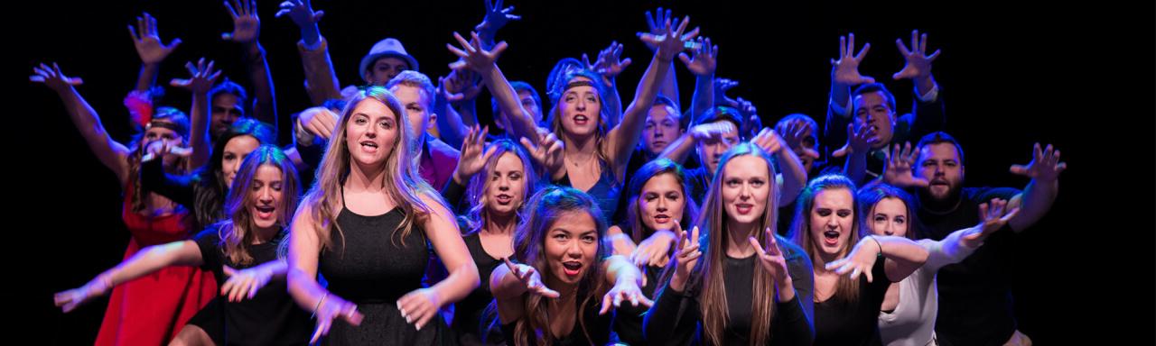 Group photo of fraternity and sorority members performing a lip sync routine